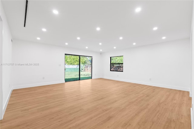 unfurnished room with recessed lighting, baseboards, and light wood finished floors