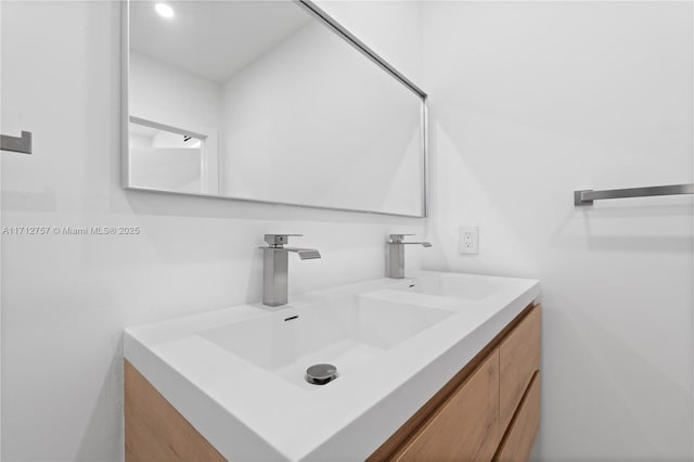 bathroom featuring double vanity and a sink