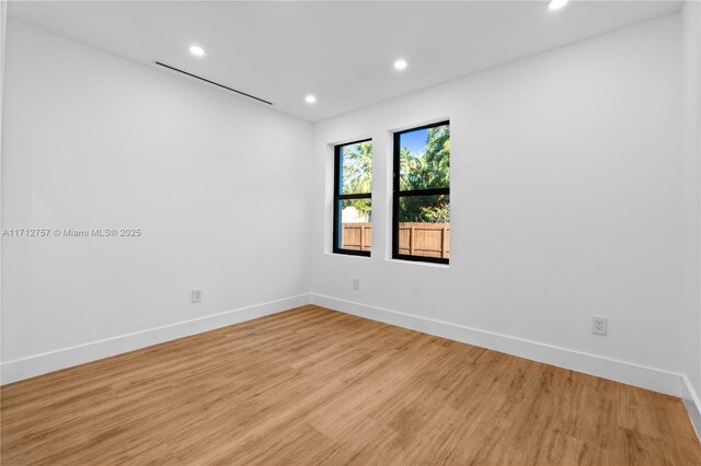 665 NE 117th St, Biscayne Park, FL 33161 - spare room with recessed lighting and light wood-type flooring