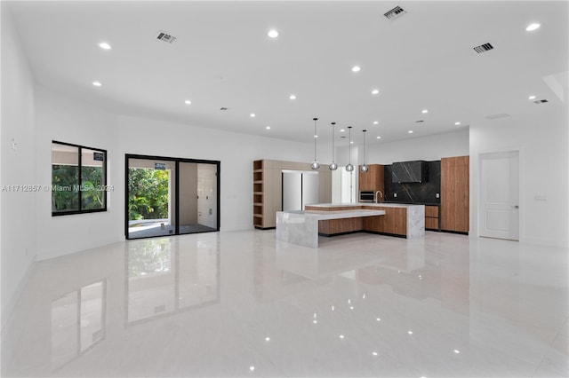 kitchen with decorative light fixtures and a large island