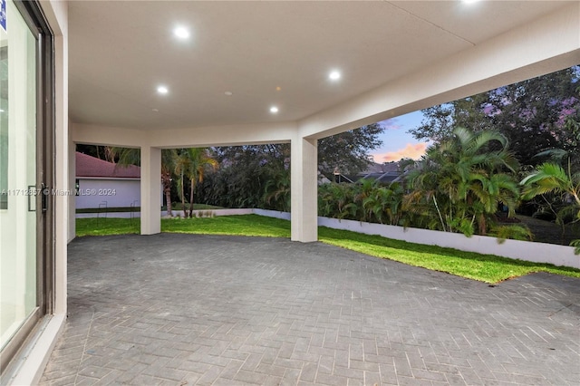 patio terrace at dusk with a lawn