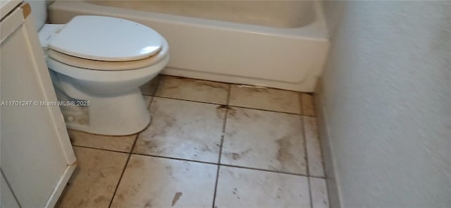 bathroom with tile patterned flooring, vanity, and toilet