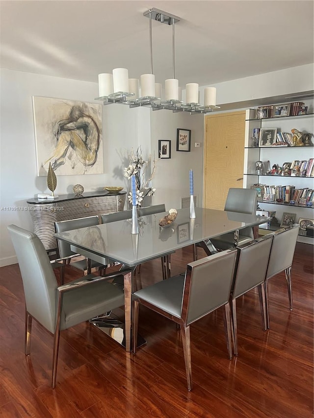 dining space with hardwood / wood-style floors