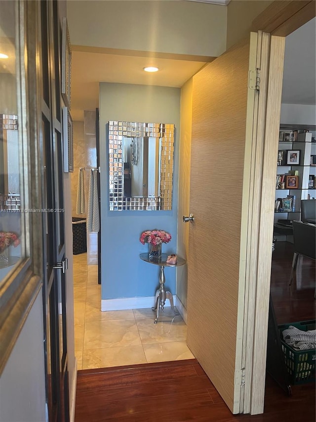 hallway featuring tile patterned floors