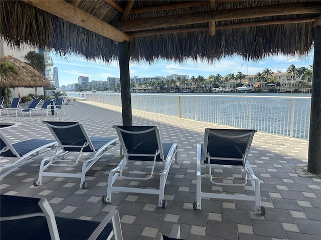 view of patio / terrace with a gazebo and a water view