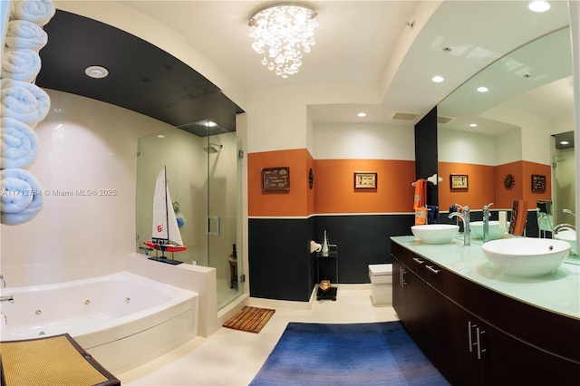 full bathroom featuring a chandelier, vanity, toilet, and independent shower and bath