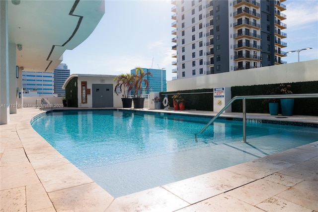 view of swimming pool with a patio