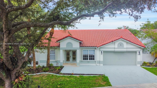 view of front of house featuring french doors and a garage