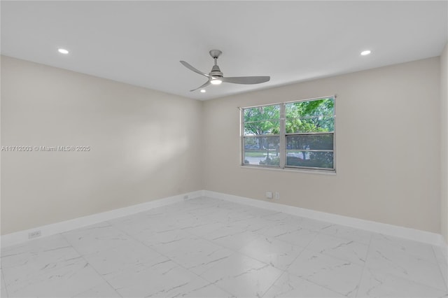 spare room with ceiling fan