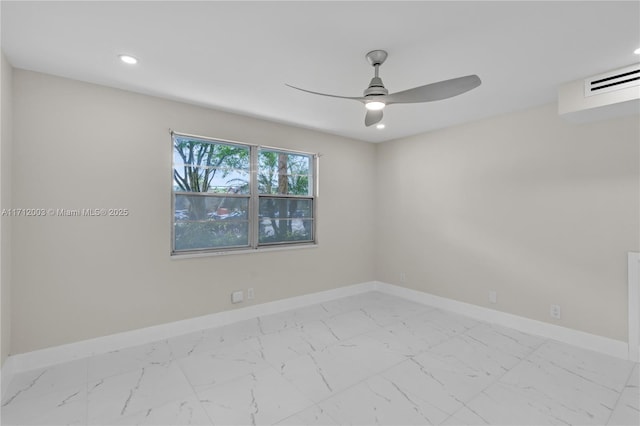 spare room with ceiling fan