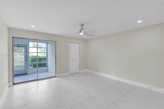 unfurnished room with ceiling fan