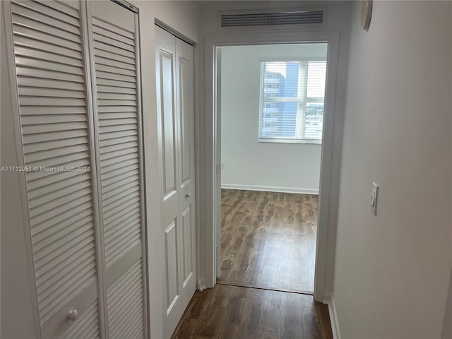 hall featuring dark wood-type flooring