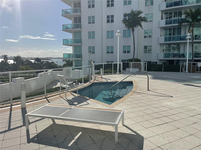 view of swimming pool featuring a patio area