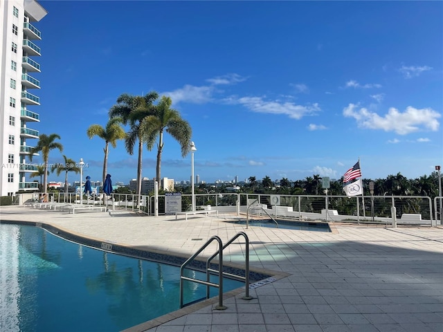 view of swimming pool featuring a patio area