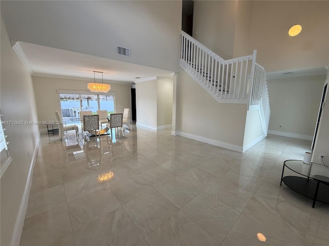 interior space featuring a notable chandelier and ornamental molding