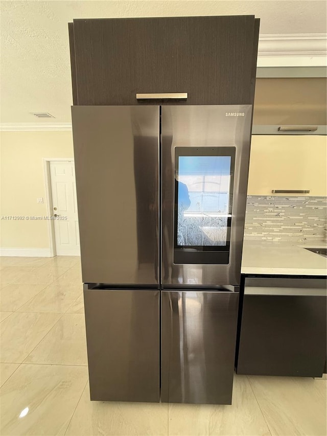 details with stainless steel refrigerator and ornamental molding