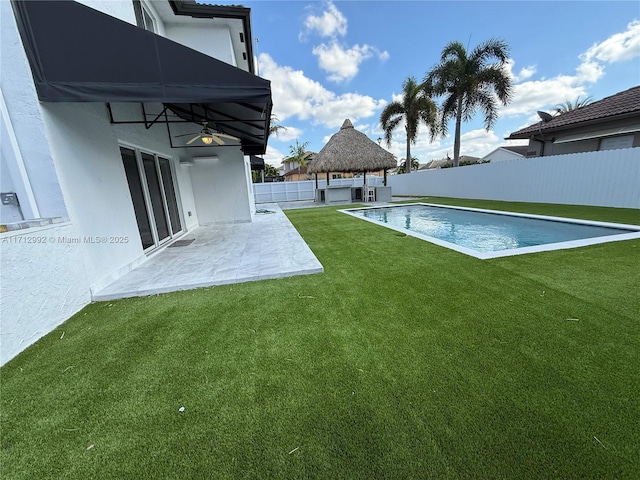 view of yard featuring a gazebo, a patio area, and a fenced in pool