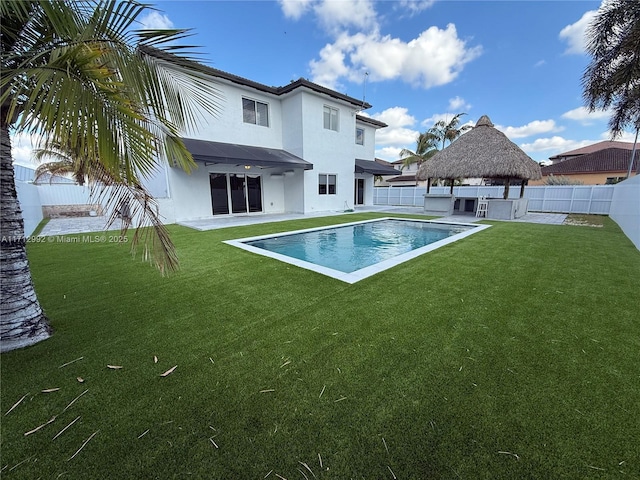 view of pool with a gazebo, a yard, and a patio