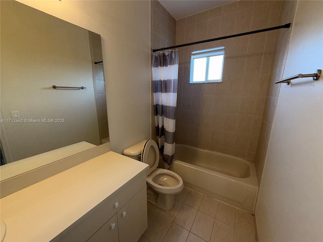 full bathroom featuring toilet, vanity, tile patterned floors, and shower / tub combo with curtain