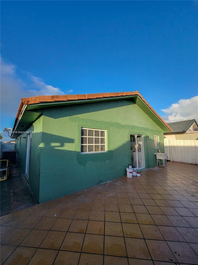 rear view of property featuring a patio