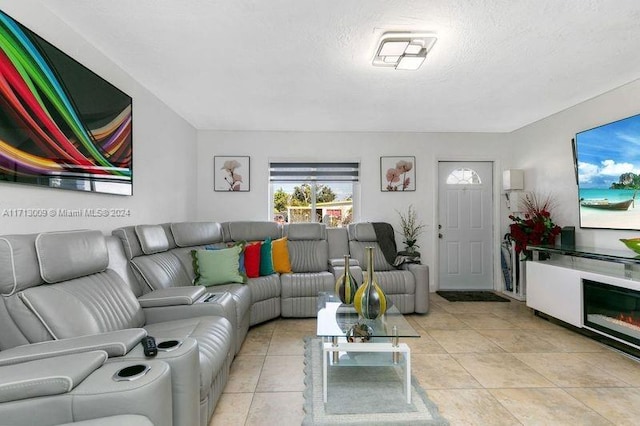 tiled living room with a textured ceiling