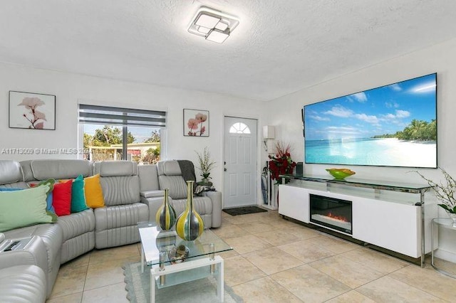 tiled living room with a textured ceiling