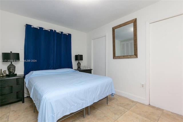 bedroom with tile patterned floors