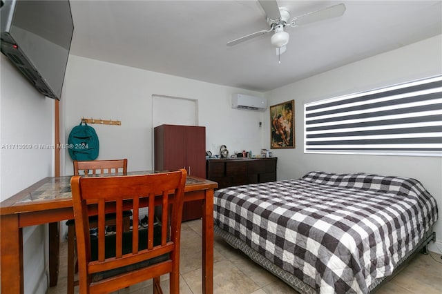 bedroom featuring light tile patterned floors, a wall mounted AC, and ceiling fan