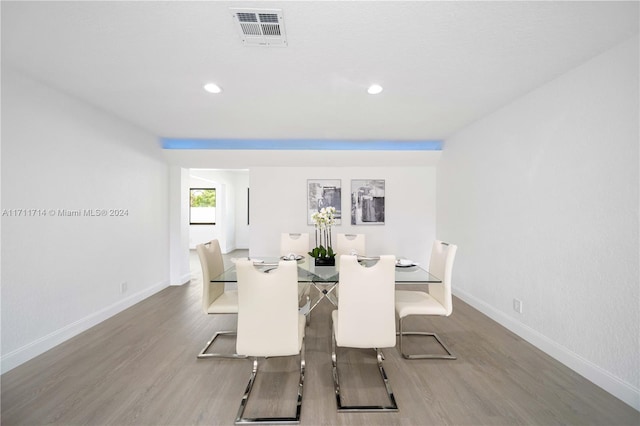 dining space featuring hardwood / wood-style flooring