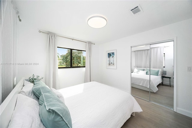 bedroom with hardwood / wood-style floors