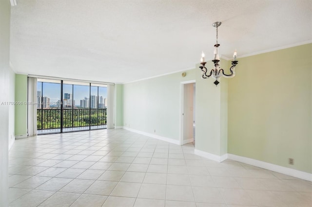 unfurnished room with an inviting chandelier, expansive windows, crown molding, a textured ceiling, and light tile patterned floors