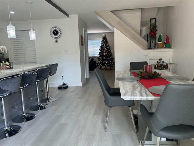 dining space with light hardwood / wood-style flooring