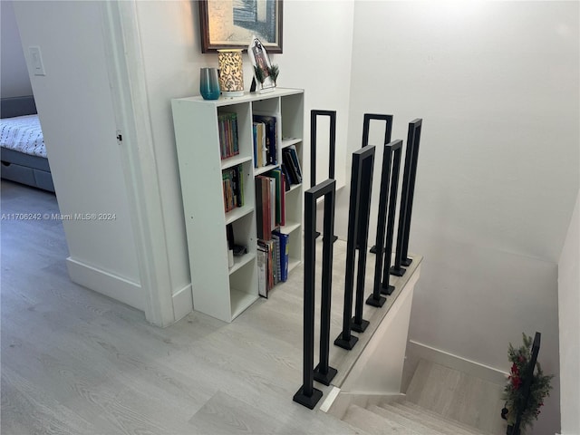 stairway featuring hardwood / wood-style flooring