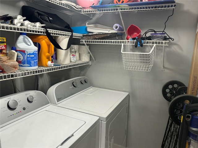 laundry area featuring washing machine and clothes dryer