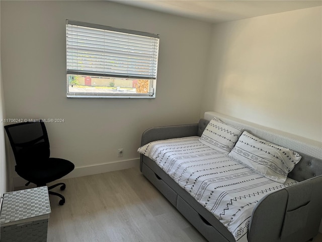 bedroom with light wood-type flooring