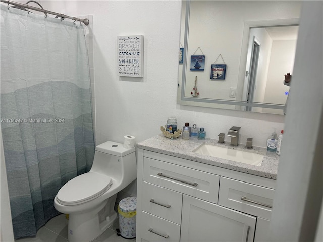 bathroom with tile patterned floors, a shower with curtain, vanity, and toilet