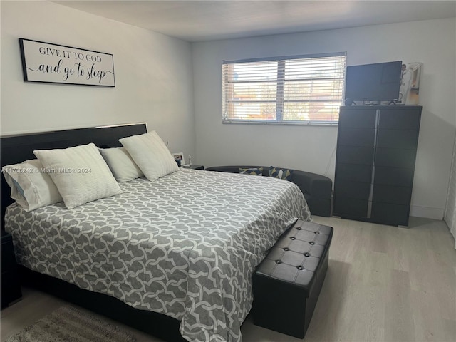 bedroom with light hardwood / wood-style floors