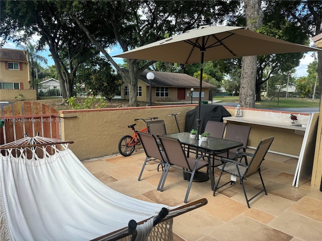 view of patio featuring a grill