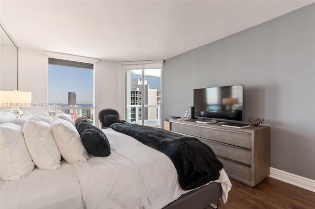 bedroom with dark wood-type flooring