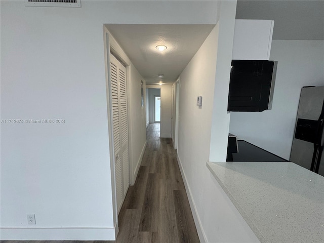 corridor with dark wood-type flooring