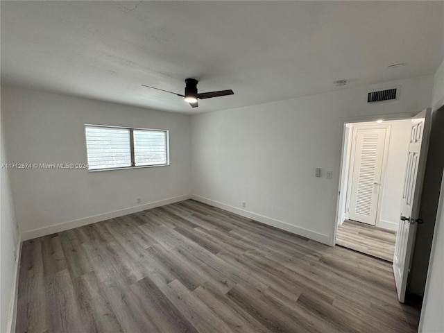 unfurnished room featuring ceiling fan and light wood-type flooring