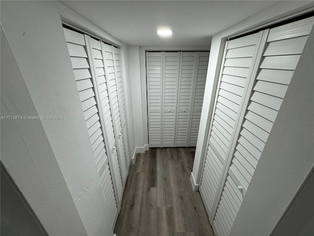 hallway featuring dark hardwood / wood-style flooring