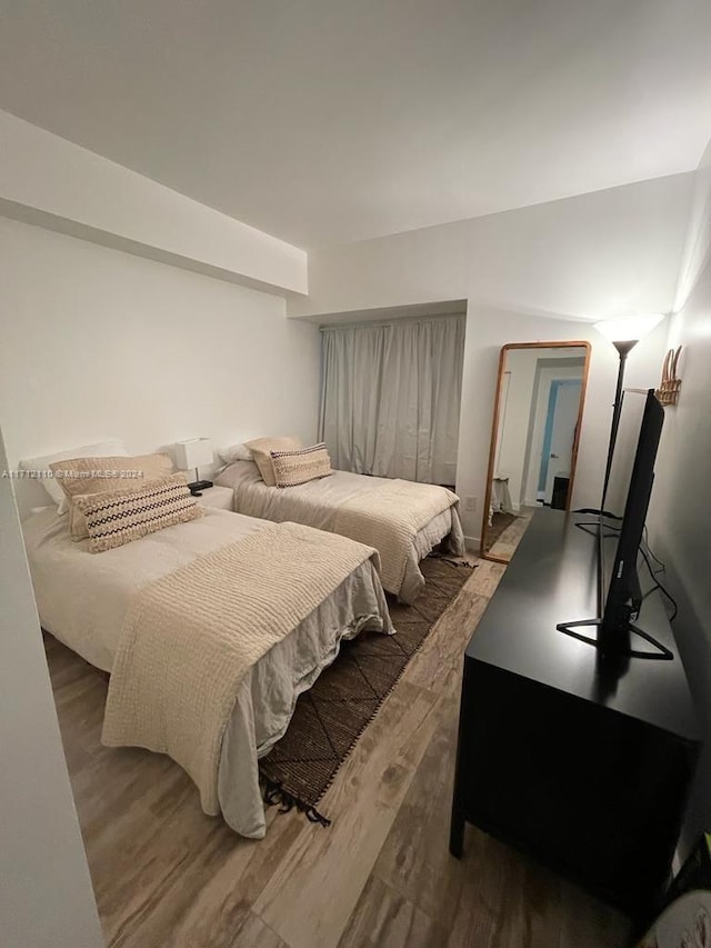 bedroom featuring dark wood-type flooring