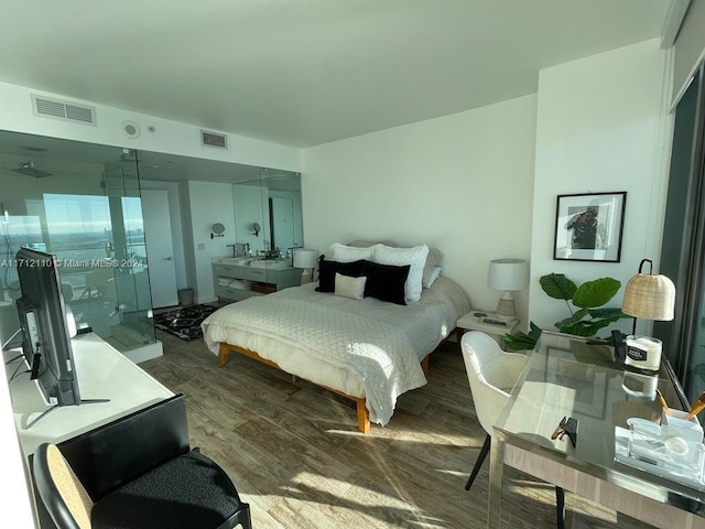 bedroom with dark wood-type flooring