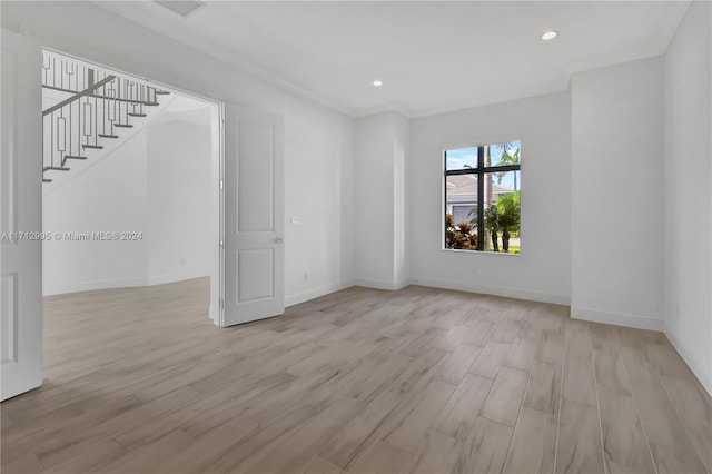 empty room with light hardwood / wood-style floors