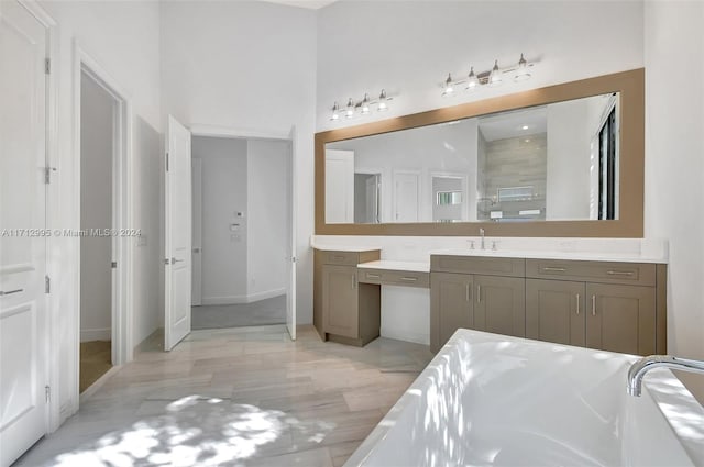 bathroom featuring hardwood / wood-style floors, vanity, and independent shower and bath