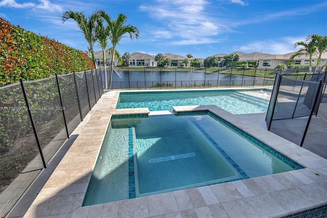 view of pool featuring an in ground hot tub and a water view