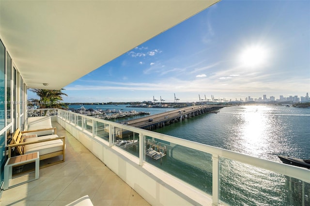 balcony featuring a water view