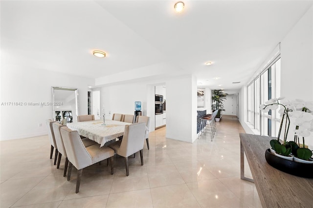 dining space with light tile patterned floors