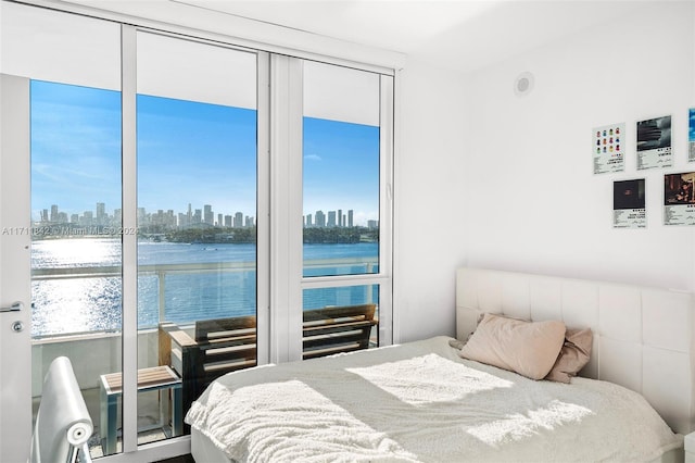 bedroom featuring a water view